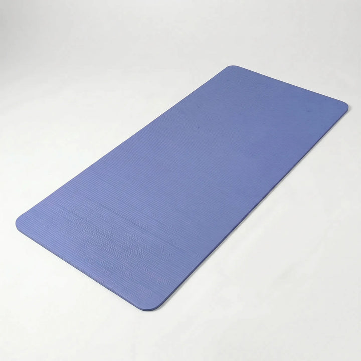 Durable pilates & yoga mat, thick & cushioned for comfortable home gym stretching.