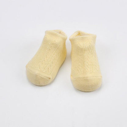 Close-up of a baby anti-slip mesh cotton sock showing soft breathable fabric and grippers