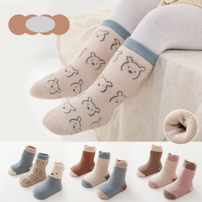 Three pairs of baby's thick warm autumn-winter cotton blend socks in various colors, infant apparel