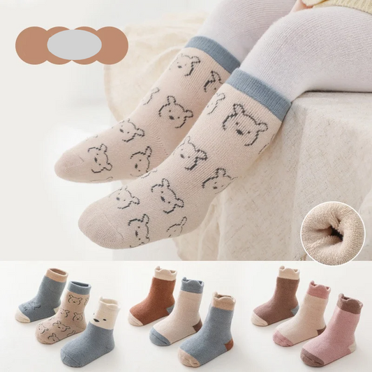 Three pairs of baby's thick warm autumn-winter cotton blend socks in various colors, infant apparel