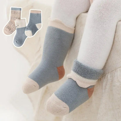 Close-up of cozy knit baby socks, perfect for cold weather, toddler footwear, cotton blend