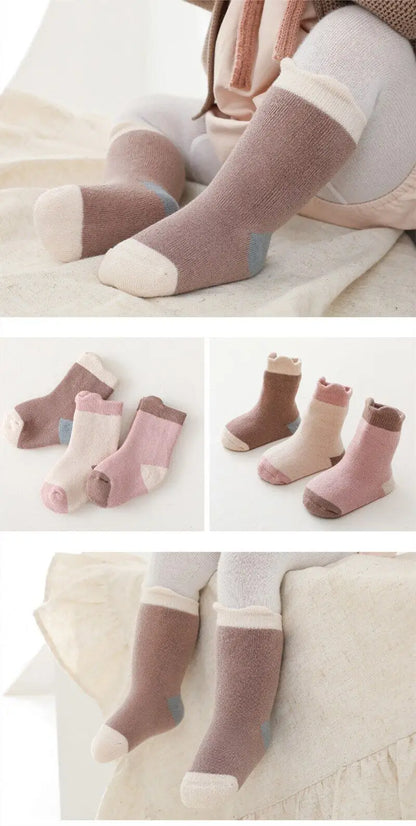 Cute and warm cotton blend baby socks in a triple pack, ideal for autumn and winter months