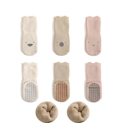 Unisex newborn socks, anti-slip design with a cozy winter theme and adorable cartoons