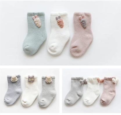 Infant winter socks, a pack of three with adorable animal character designs for babies.