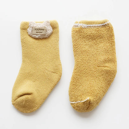 Toddler animal socks, a set of three pairs, showcasing fox, bear, and rabbit designs on comfortable fabric.