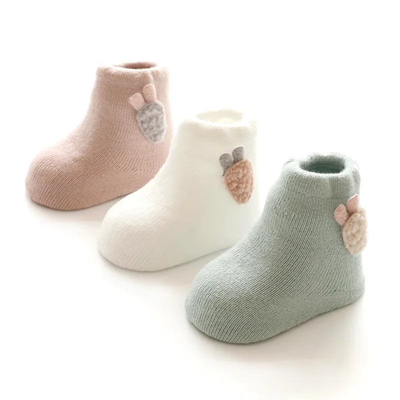 Assorted winter baby socks, featuring cute animal faces like bear, fox, and rabbit for infant apparel.