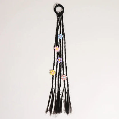 Heart and flower themed hair beads on an elastic hair tie, a charming children's accessory