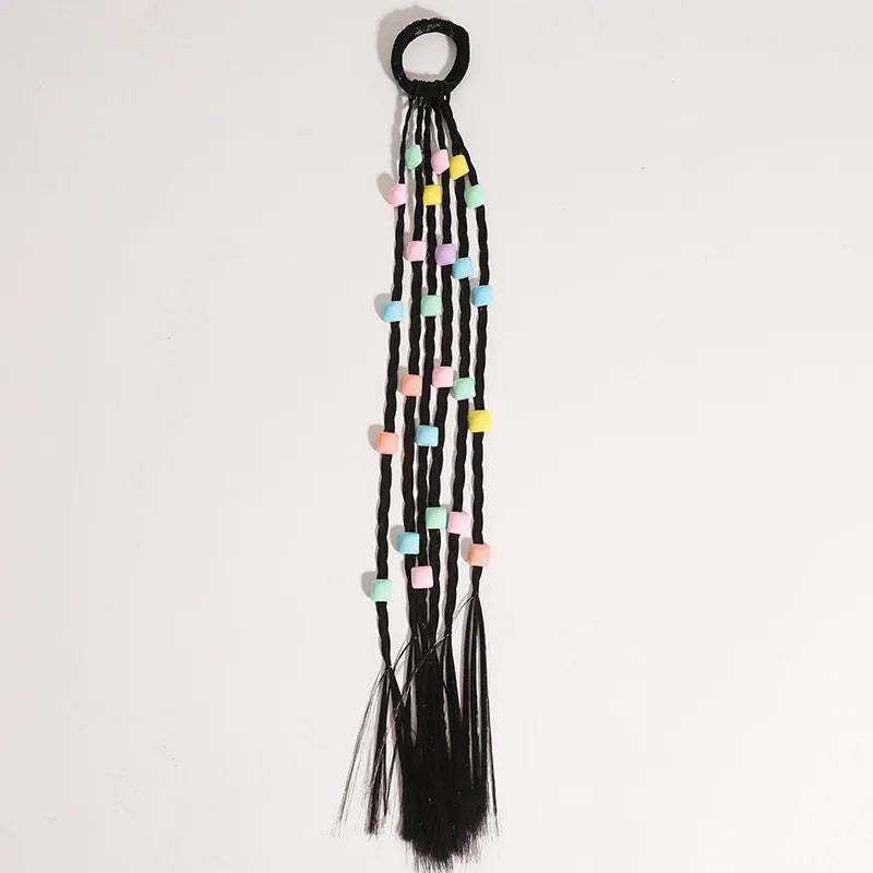 Closeup of colorful flower and heart hair beads, a cute clip-in ponytail accessory for kids