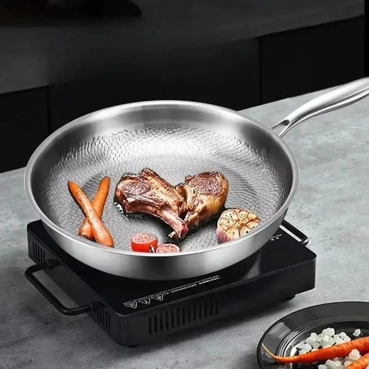 Durable titanium non-stick frying pan with a unique hammered finish, perfect for induction cooking.