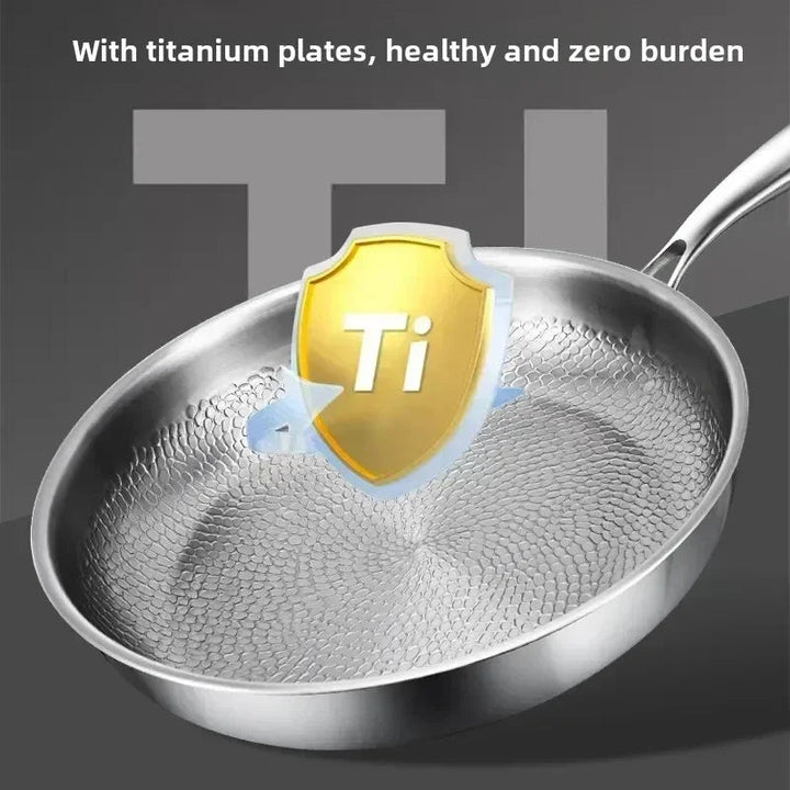 Versatile induction compatible skillet, featuring a hammered titanium non-stick surface for easy cooking.