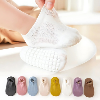 Toddler anti-slip ankle socks in blue with grippy soles, perfect for baby's first steps and indoor play