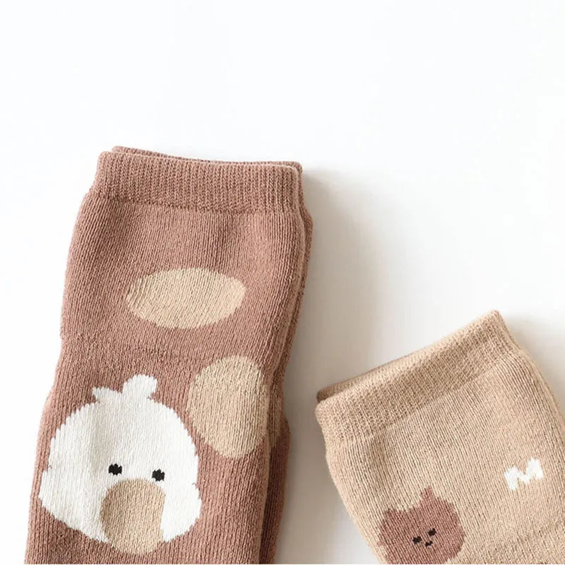 Soft toddler non-slip cartoon sheep socks, cozy winter baby footwear, unisex design.