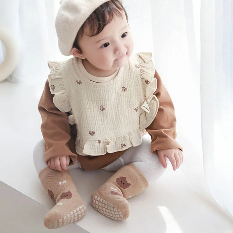 Winter baby anti-slip cartoon rocket socks, warm and secure footwear for little explorers.