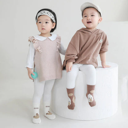 Grippy toddler winter socks with cute cartoon animal design, cozy baby footwear.