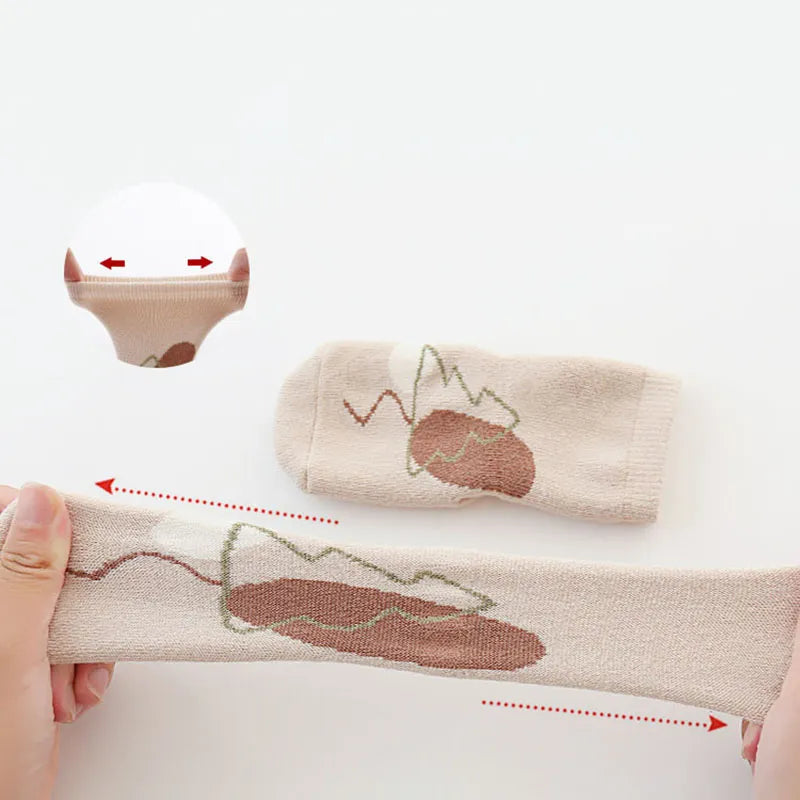 Cozy toddler anti-slip cartoon elephant socks, ideal grippy winter footwear for babies.
