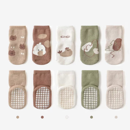 Soft toddler anti-slip cartoon star socks, warm and grippy baby footwear for cold weather.