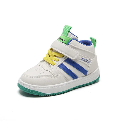 Pair of anti-slip kids casual shoes on a hardwood floor, ready for indoor active play