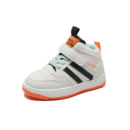 Child running outdoors in anti-slip toddler trainers, demonstrating flexibility & comfort