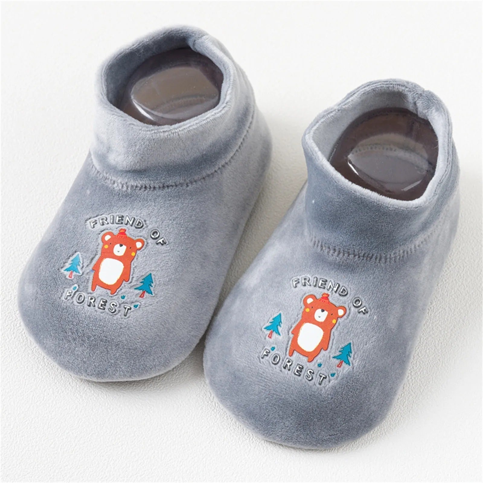 A pair of yellow kids anti-slip sock shoes, combining warmth and safety for active toddlers.