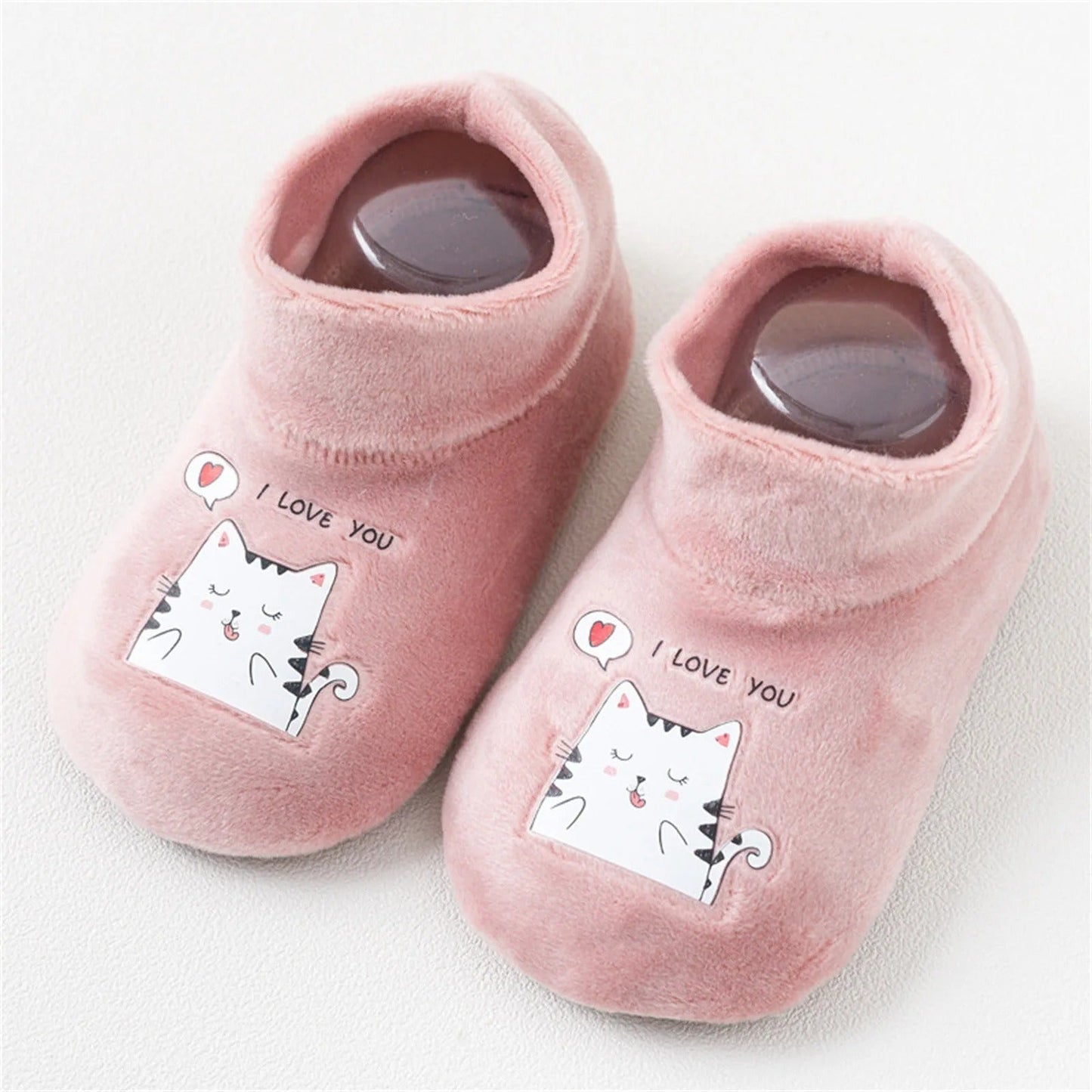 Variety of colorful anti-slip gripper sock shoes for babies and toddlers, showcasing different patterns and warmth.