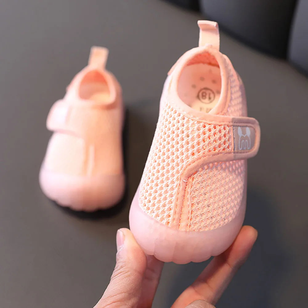 Pair of pink kids breathable mesh shoes, ideal anti-slip summer footwear for toddlers.