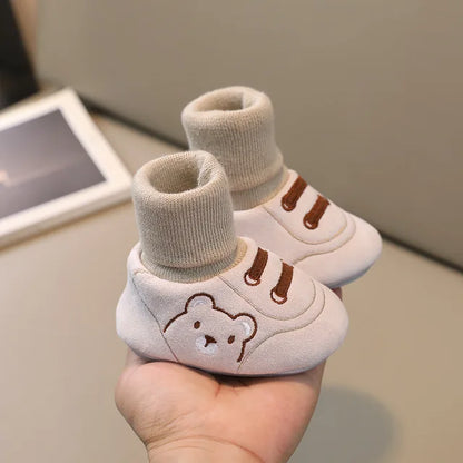 Infant anti-slip softsole socks in a neutral color, perfect kidswear for learning to walk