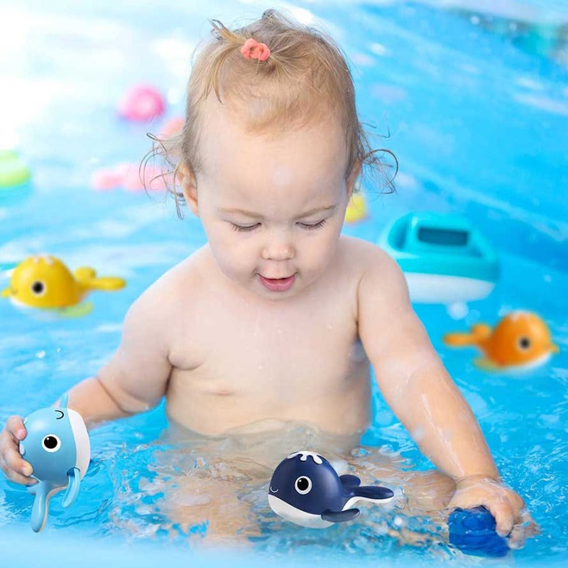 Close-up of a blue wind-up whale from a toddler bath fishing game, perfect for water play