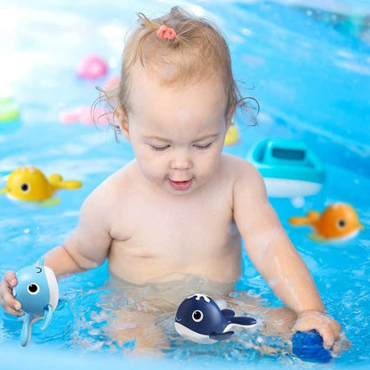Close-up of a blue wind-up whale from a toddler bath fishing game, perfect for water play