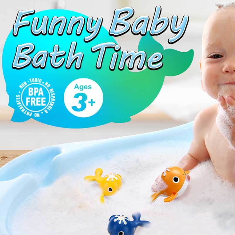 Toddler enjoying a bath fishing game, catching a whale with a magnetic rod