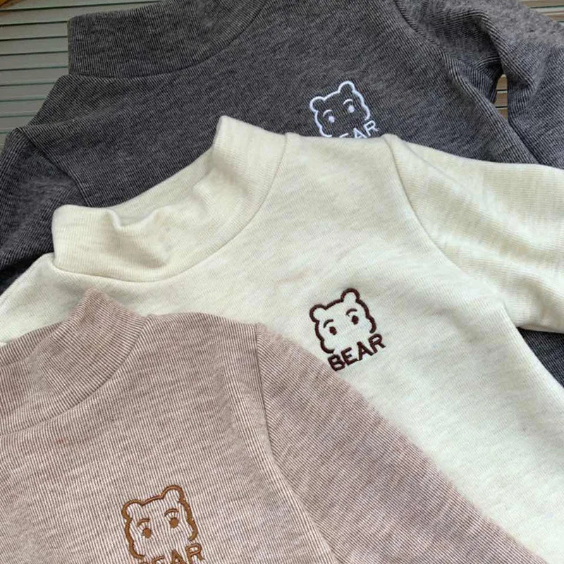 Close-up of soft bear fleece turtleneck shirt for toddlers, warm long sleeve