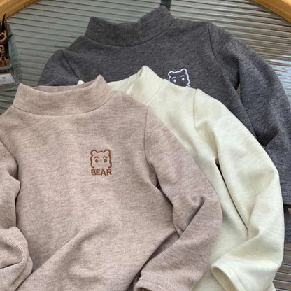 Front view of a cozy bear fleece turtleneck shirt, soft toddler apparel