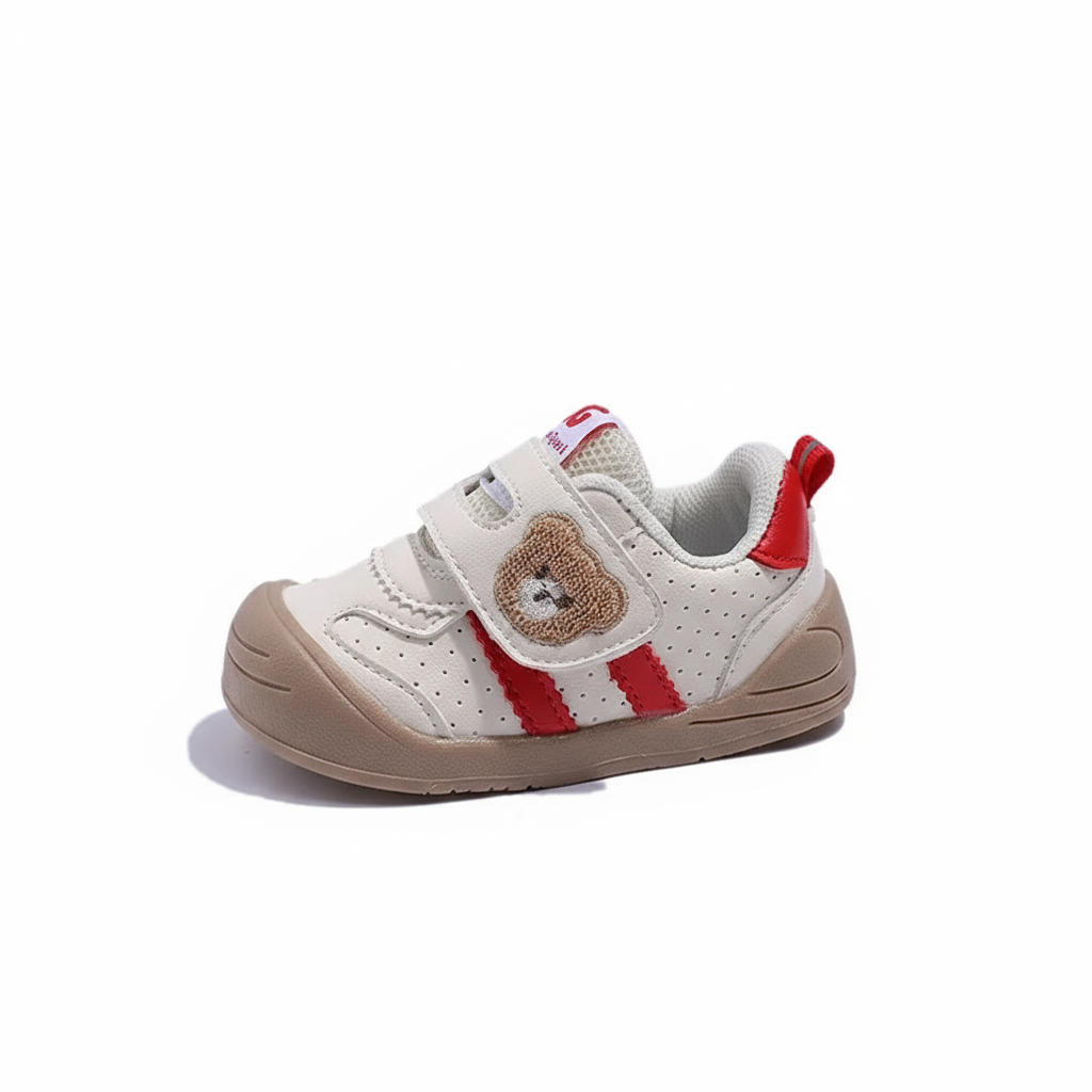 Close-up of children's footwear: bear pattern Velcro sneakers, durable for toddlers