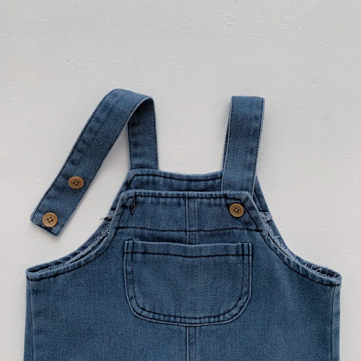 Back view of toddler boy's denim t-shirt and jumpsuit set, perfect for summer play, two-piece outfit.