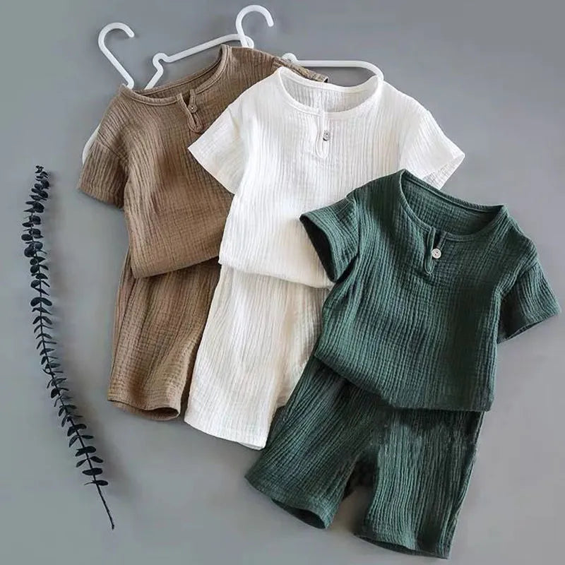 Toddler boy in blue linen cotton t-shirt shorts set, perfect for summer playwear