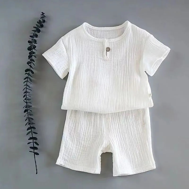 Side view of a toddler boy's linen cotton set, showing relaxed fit for active play