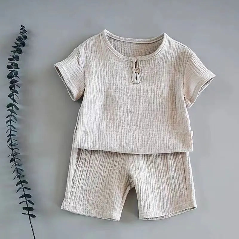 A child running in a lightweight linen cotton t-shirt shorts set, freedom for movement