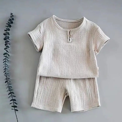 Flat lay of a boys' linen cotton t-shirt shorts set, essential breathable kids apparel