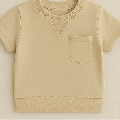 Close-up of soft cotton fabric on a toddler boys' summer outfit, great for comfort and play.