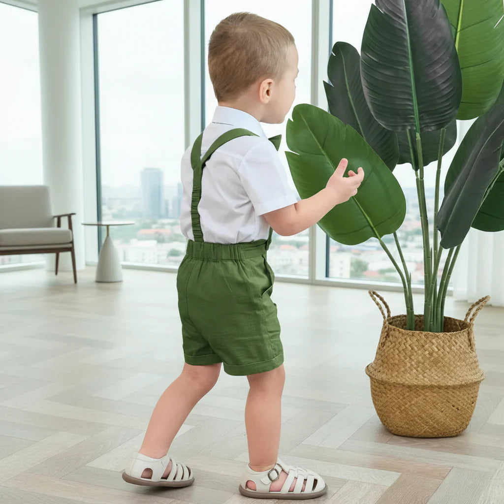 Close-up of a boys' formal cotton linen shorts set, featuring adjustable suspenders and a pre-tied bow tie