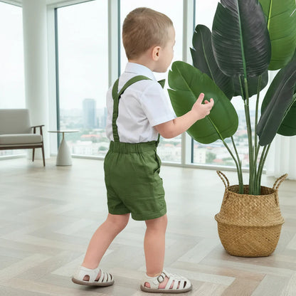 Close-up of a boys' formal cotton linen shorts set, featuring adjustable suspenders and a pre-tied bow tie