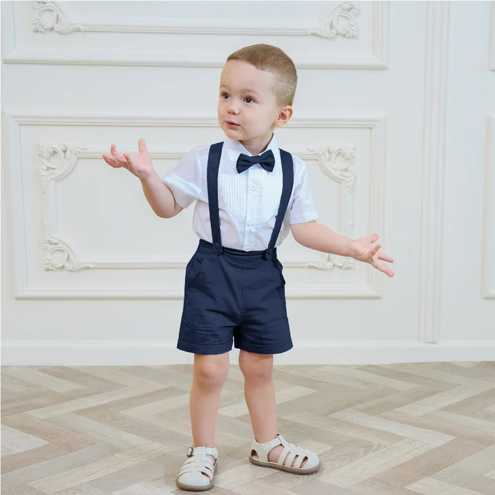 Stylish boys' special occasion outfit with comfortable cotton shorts, dark blue suspenders, and matching bow tie