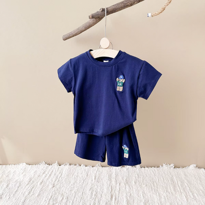 Toddler boy in urban bear print t-shirt and shorts, perfect lightweight cotton blend summer outfit playwear.