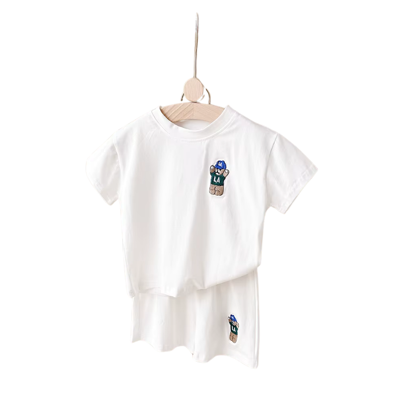 Close-up of a toddler boy's cotton blend t-shirt with a stylish urban bear print, part of a summer set.