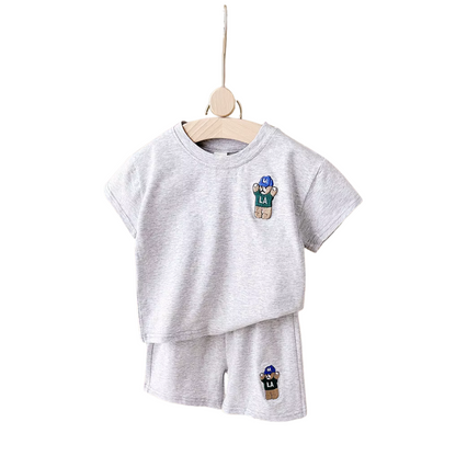 Urban bear print toddler boy's summer outfit set, showing a lightweight t-shirt and matching shorts for kids fashion.