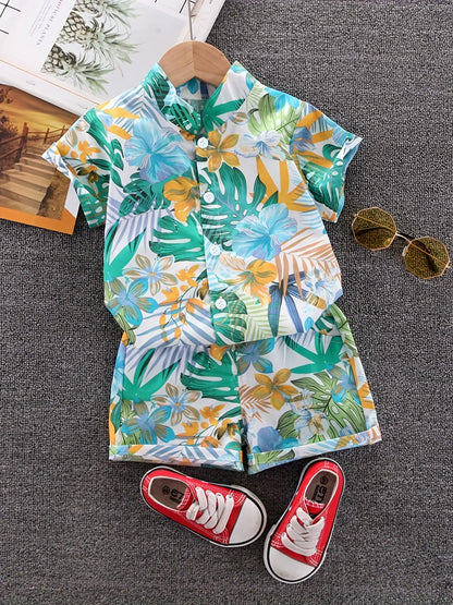 Kids apparel: White cotton short-sleeve set with attractive green leaf & blue floral patterns, toddler fashion.