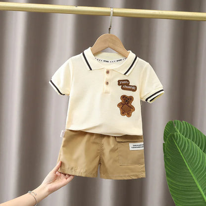 Close-up of a boys' comfortable cotton polo shirt and patterned shorts for summer