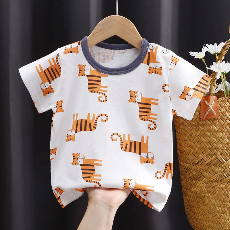 Newborn wearing a white cotton cartoon bear t-shirt, gentle infant apparel
