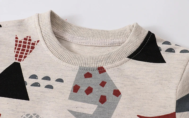 Close-up of a soft cotton crewneck sweater for kids, featuring a vibrant car print.