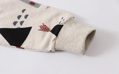 Multiple kids' crewneck sweaters in various colors, showcasing fun animal and vehicle prints.