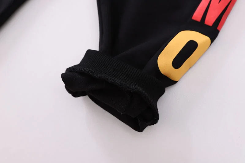 Close-up of the cuffs on the long-sleeve blue cotton t-shirt for toddler boys.
